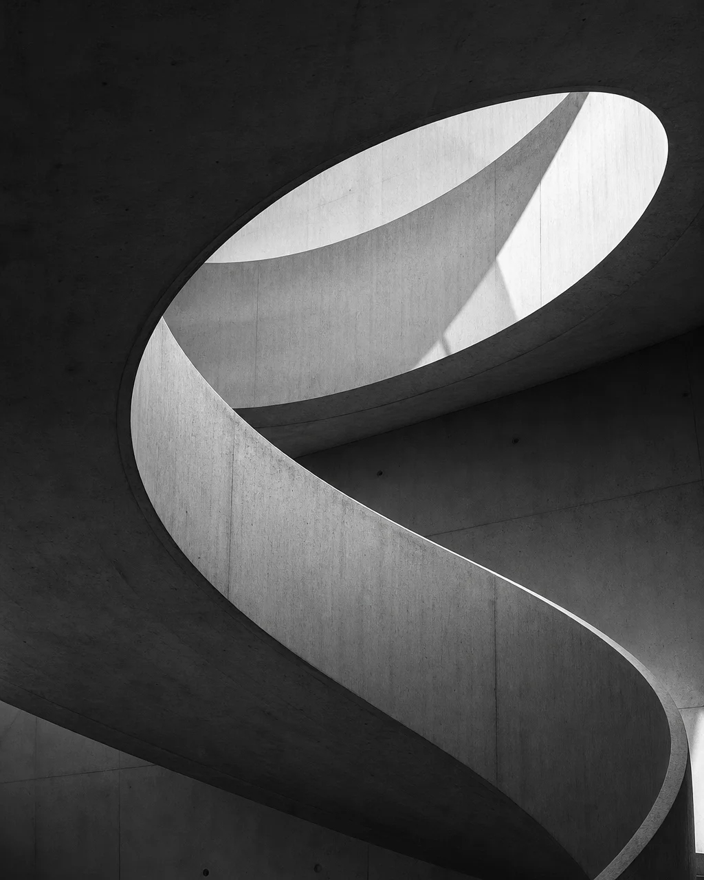 Spiral concrete staircase seen from below